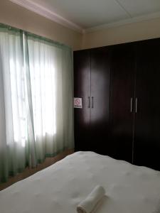 Ένα ή περισσότερα κρεβάτια σε δωμάτιο στο Nonesi Lodge