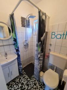 Kúpeľňa v ubytovaní Apartmani Levarda