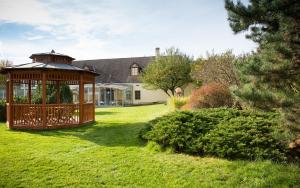 a gazebo in the yard of a house at Hotel Baroko in Prague