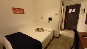 Łóżko lub łóżka w pokoju w obiekcie LH Hotel Excel Roma Montemario