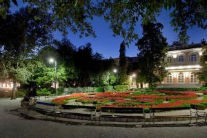 a large garden with flowers in front of a building at Apartments Villa Dinka in Opatija