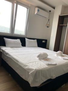 Postel nebo postele na pokoji v ubytování Kubi Hotel