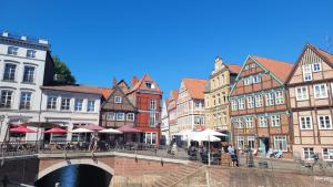 a bridge over a river in a city with buildings at Das Stader Loft in Stade