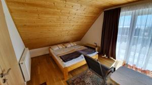 Postel nebo postele na pokoji v ubytování Mandula Apartmanok