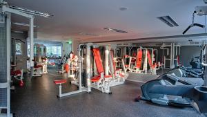 a gym with a bunch of equipment in it at Gradiali Wellness and SPA in Palanga