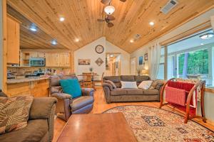 a living room with a couch and chairs and a table at Smithville Remote Escape with Furnished Deck! in Smithville