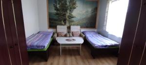 a room with two futon beds and a painting at Ubytování Ostrov u Macochy in Ostrov u Macochy