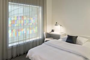 Letto o letti in una camera di Trafo Hotel Baden