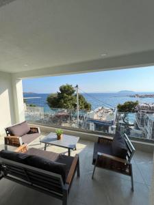 a living room with a view of the ocean at Wide Blue Luxury Boutique Suites in Neos Marmaras