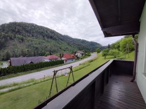 a balcony of a house with a view of a road at Haus Kink 