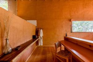 a room with a wooden bench and a window at Pueblo del Sol Hotel Retreat in Puerto Escondido +27 photos