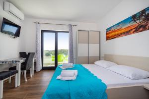 Postel nebo postele na pokoji v ubytování Villa Laura View