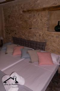 A bed or beds in a room at CASA LO PASTELER