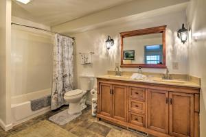 a bathroom with a toilet and a sink and a shower at Bright Springfield Home Walk to Nature Center! in Springfield +33 photos