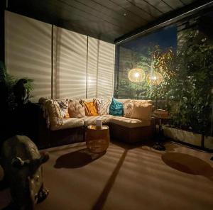 A seating area at Giresio 41 - Your Penthouse with Rooftop Garden in Milano Navigli - WIFI