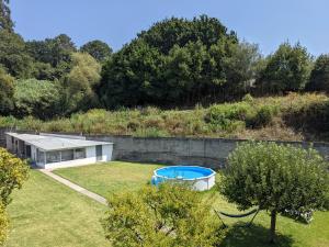 a house with a swimming pool in a yard at Bolboreta Nigrán in Nigrán