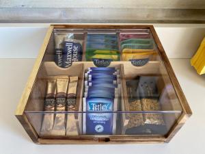 a wooden box filled with different types of food at Adorable Cabin in the Countryside in Portlaoise