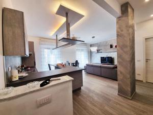 a large kitchen with a large island in a room at Casa Vacanza 5 Terre in La Spezia