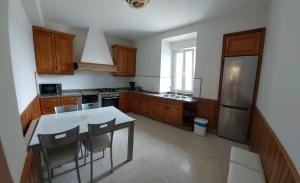 Kuchyň nebo kuchyňský kout v ubytování O recuncho do xeixido