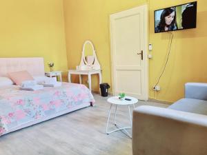 Postel nebo postele na pokoji v ubytování Rose Guest House