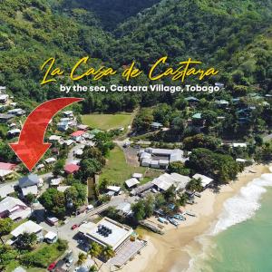 an aerial view of a resort on a beach at La Casa de Castara in Castara