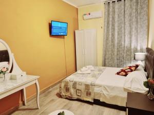 Postel nebo postele na pokoji v ubytování Rose Guest House
