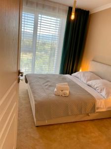 Postel nebo postele na pokoji v ubytování Apartmány pod Zámkom