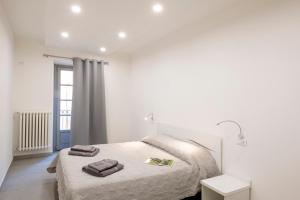 A bed or beds in a room at Dream Baveno