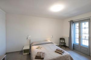 A bed or beds in a room at Dream Baveno