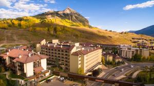 an aerial view of a city with a mountain at Elevation Hotel & Spa in Mount Crested Butte