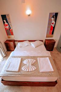 Postel nebo postele na pokoji v ubytování Gödence Hotel Restoran Bungalow
