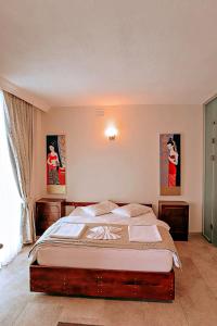 Postel nebo postele na pokoji v ubytování Gödence Hotel Restoran Bungalow
