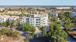 an aerial view of a city with palm trees and condos at Grupo Morgado - Quinta do Morgado - Morgado Exclusive in Tavira