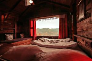 Postel nebo postele na pokoji v ubytování Gödence Hotel Restoran Bungalow