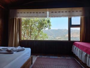 Postel nebo postele na pokoji v ubytování Gödence Hotel Restoran Bungalow