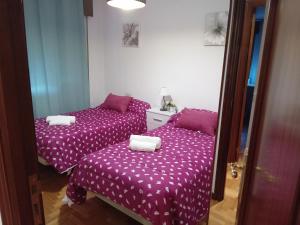 En eller flere senge i et værelse på Casa Navarro