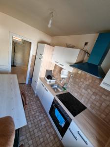 Η κουζίνα ή μικρή κουζίνα στο TS1 1-OG Möbilierte Wohnung in Wolfsburgs Zentrum