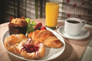 a plate of pastries and a cup of coffee on a table at New York New York in Las Vegas
