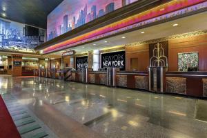 an empty lobby of a hotel with a lobby at New York-New York in Las Vegas