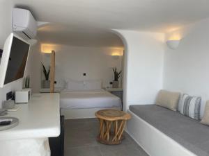 Postel nebo postele na pokoji v ubytování Nomikos Villas + 34 fotografií