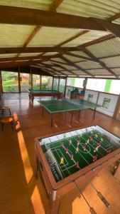 an overhead view of a pool table in a room at Moderna cabaña en medio de la naturaleza in Santandercito
