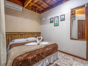 Cama o camas de una habitación en Alameda Paradiso Hotel