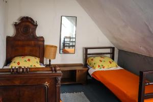 a bedroom with two beds and a mirror at Holiday house with a parking space Bobovisca, Brac - 11435 in Ložišće
