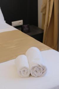 Postel nebo postele na pokoji v ubytování Mayisa Apartments