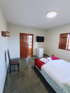 Brisa da Serra Hotel Pousada Pirenopolis客房内的一张或多张床位