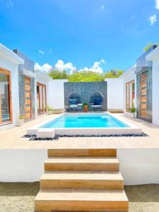 Imagen de la galería de Moringa Resort - Studio B with Pool, open Air Shared Shower Bath, en Willemstad