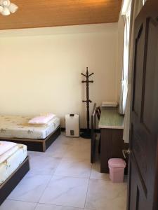 Postel nebo postele na pokoji v ubytování Dongyin Homestay連江縣民宿054號