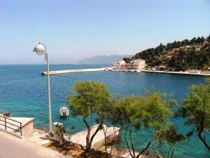 a view of a body of water with a street light at Seaside holiday house Prigradica, Korcula - 11484 in Blato