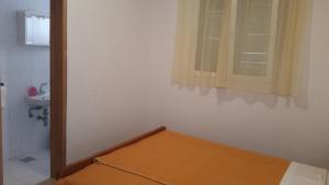 Postel nebo postele na pokoji v ubytování Apartment Sveta Nedilja 11433c
