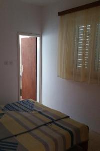 Postel nebo postele na pokoji v ubytování Apartment Sveta Nedilja 11433c